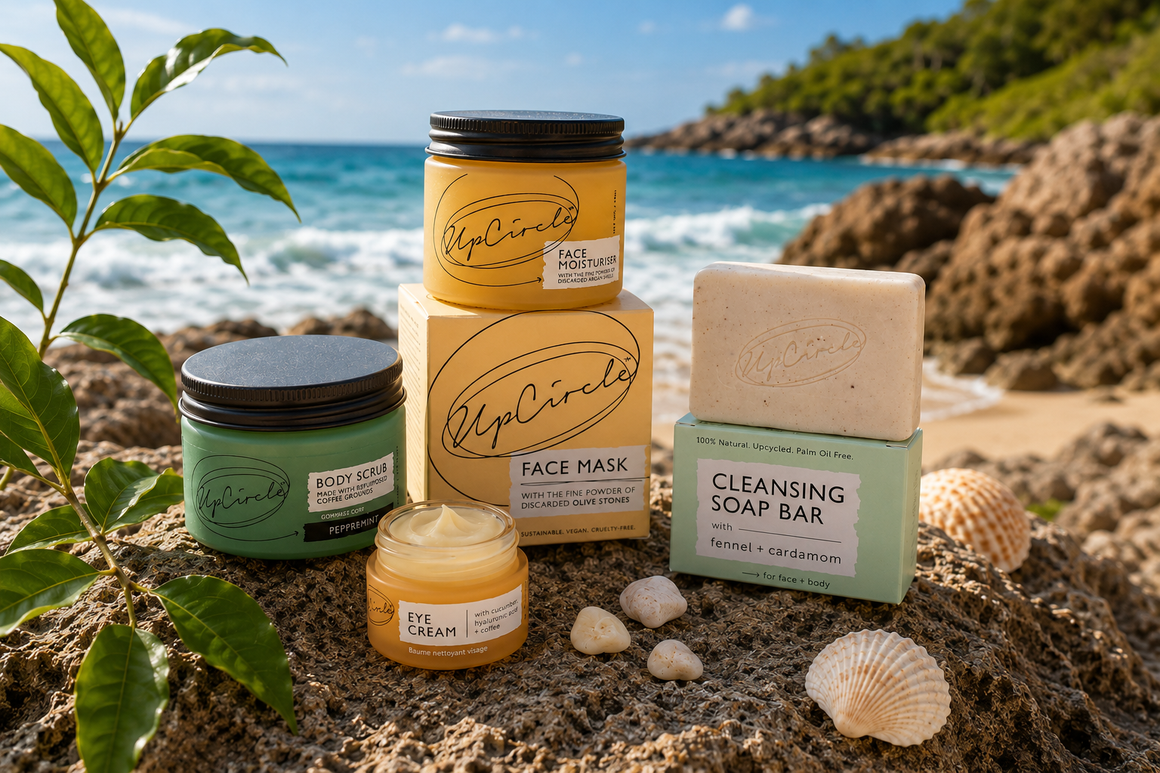 Collection of Up circle produce including cleansing bar, Face mask eye cream and body scrub on rocks