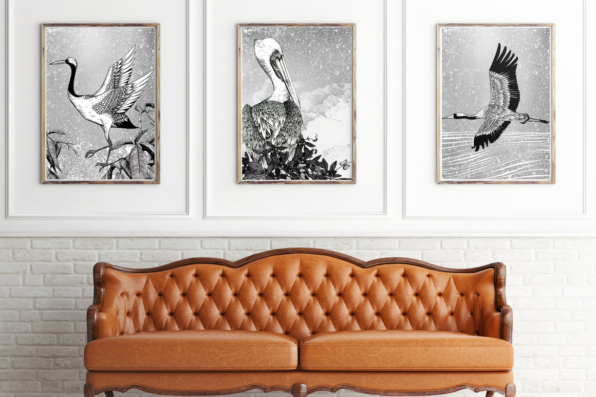 Orange seteee with 3 large framed pictures behind on the wall 