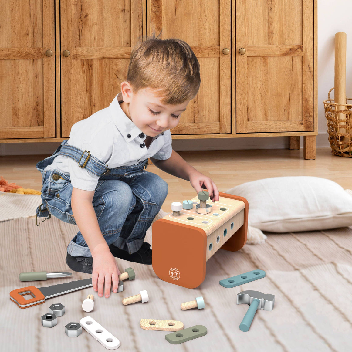 Child with wooden shape sorter toy playing on floor 