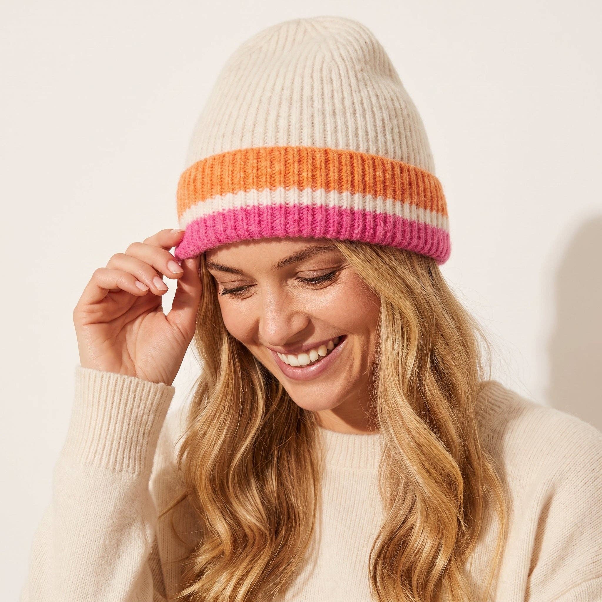 Sarta striped beanie hat in cream and pink tones