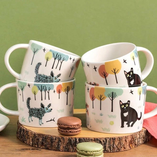 Dog mug by Hannah Turner featuring a playful dog illustration on ceramic cup, perfect for dog lovers.