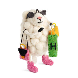 White cat-shaped toy with black ears, pink paws, and colorful bags on a white background