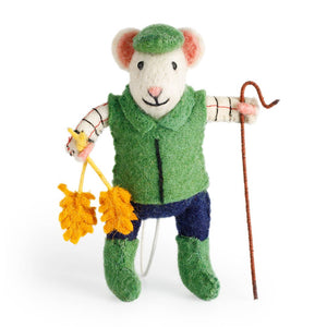 Stuffed toy mouse dressed as a shepherd holding a crook and shears on a white background