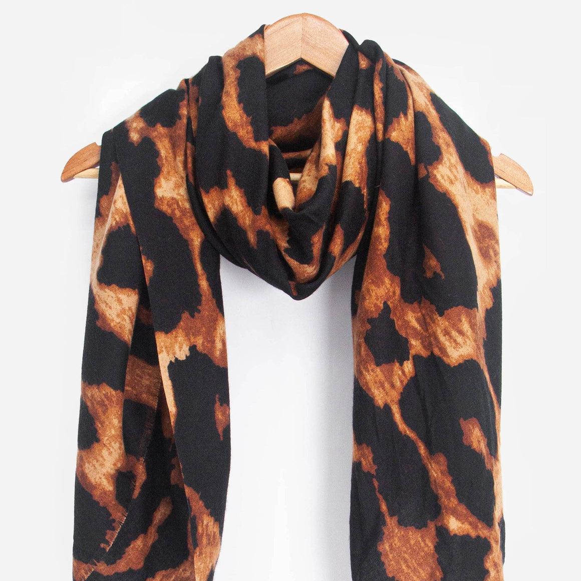 Leopard print scarf on a white background
