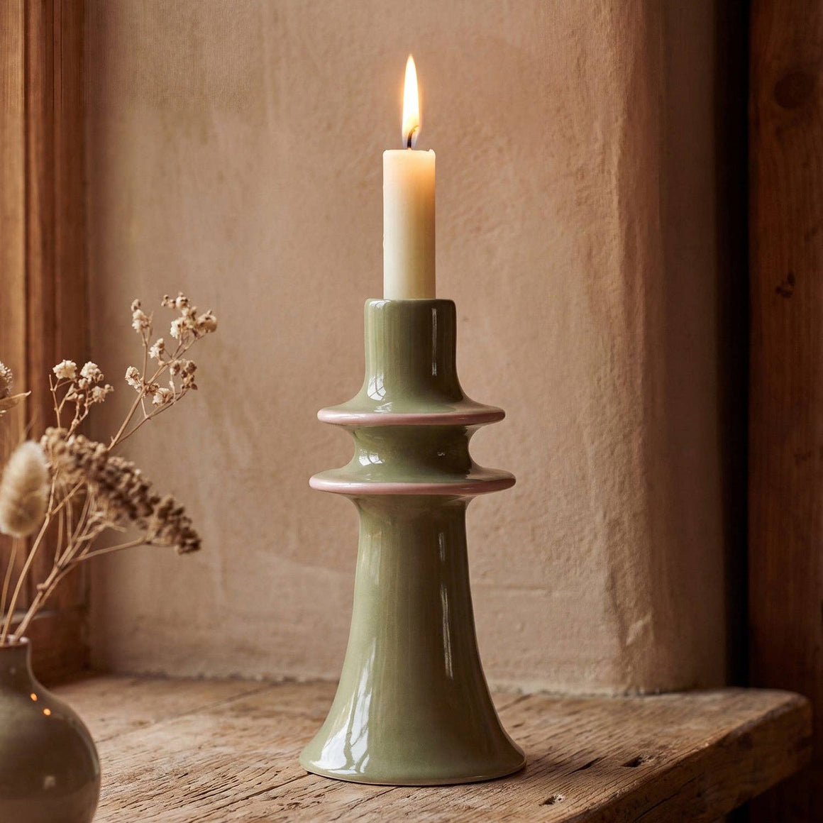 Green stoneware candlestick holder by Sophie Allport, featuring a classic design and smooth finish for decorative candle display.