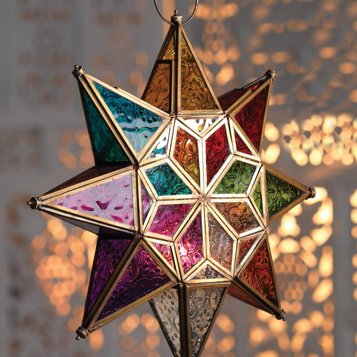 Colorful star-shaped lantern hanging against a blurred background