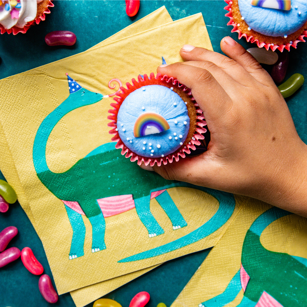 Yellow paper napkins with dinosaur design for kids' birthday parties by Bluebell and Lark