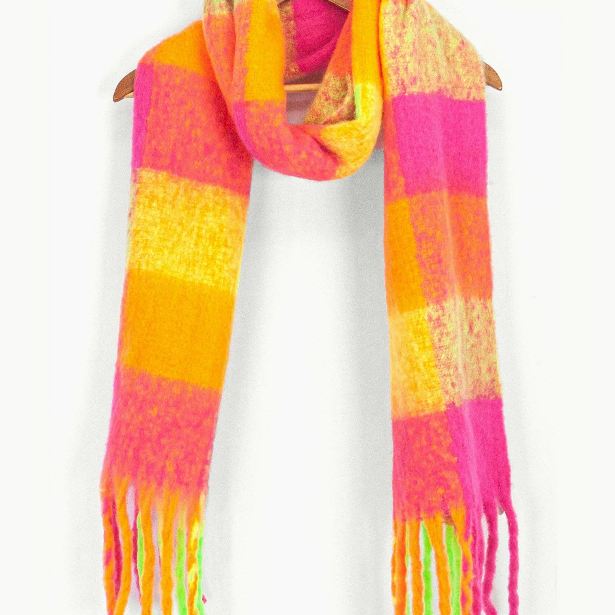 Colorful striped scarf with tassels on a white background