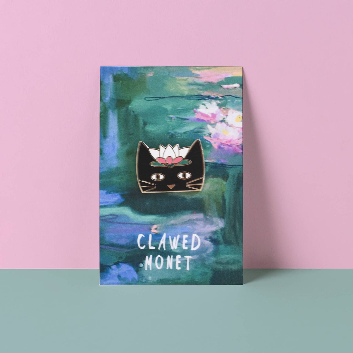 Canvas print with a black cat art piece on a pink and blue background