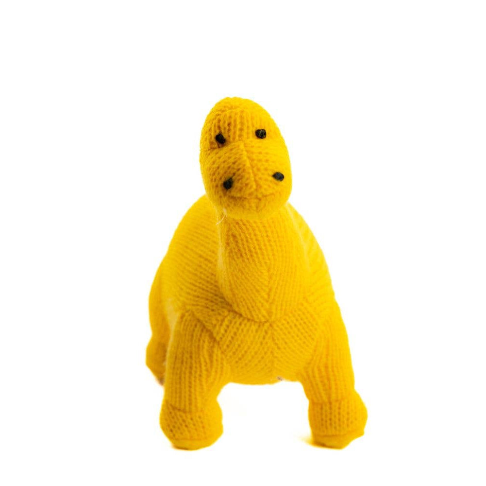 Yellow knitted dog toy on a white background