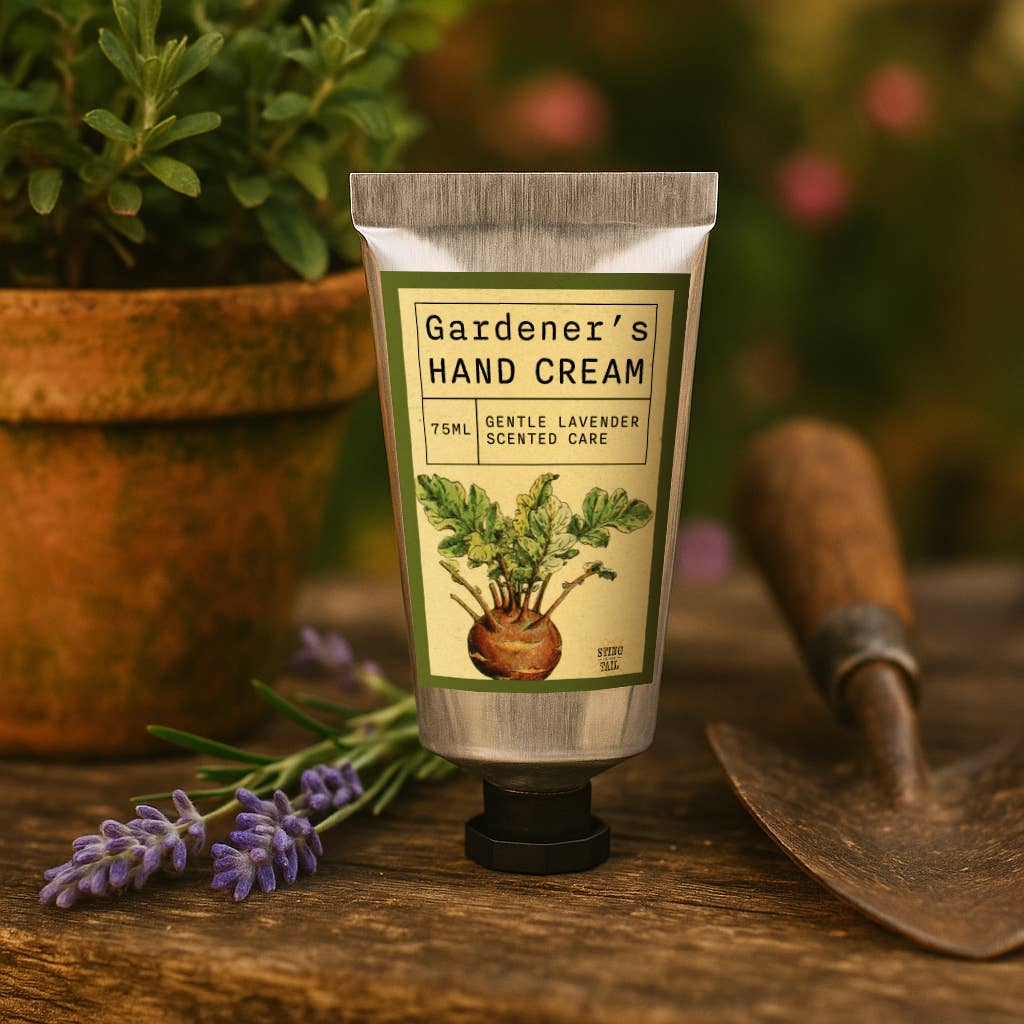 Gardener's Hand Cream on a wooden surface with plants and a trowel in the background