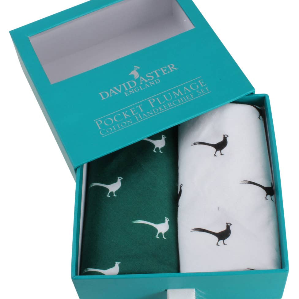 Teal box containing a white handkerchief with black pheasant design and a green pocket square with white pheasant design, branded 'David Aster'.