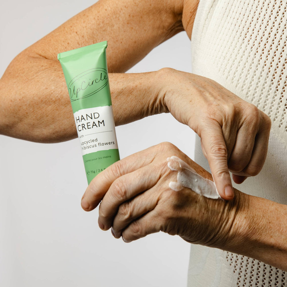 UpCircle Beauty eco-friendly hand cream with upcycled hibiscus flower, natural moisturizing skincare product.