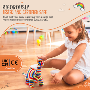 KNITTED DIPLODOCUS DINOSAUR BABY RATTLE RAINBOW STRIPES