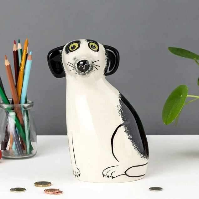  ceramic lemur-shaped money box on a white surface with a gray background