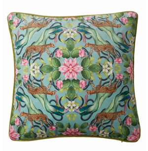 Decorative pillow with leopards and floral patterns on a blue background