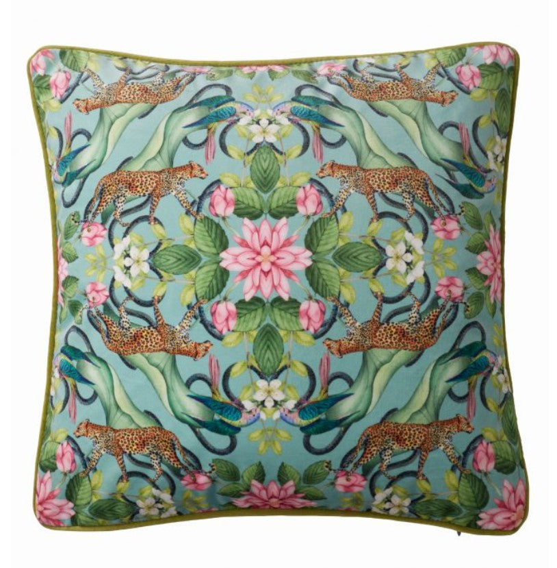 Decorative pillow with leopards, flowers, and hands holding a flower on a dark background