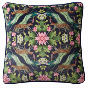 Decorative pillow with leopards, flowers, and hands holding a flower on a dark background