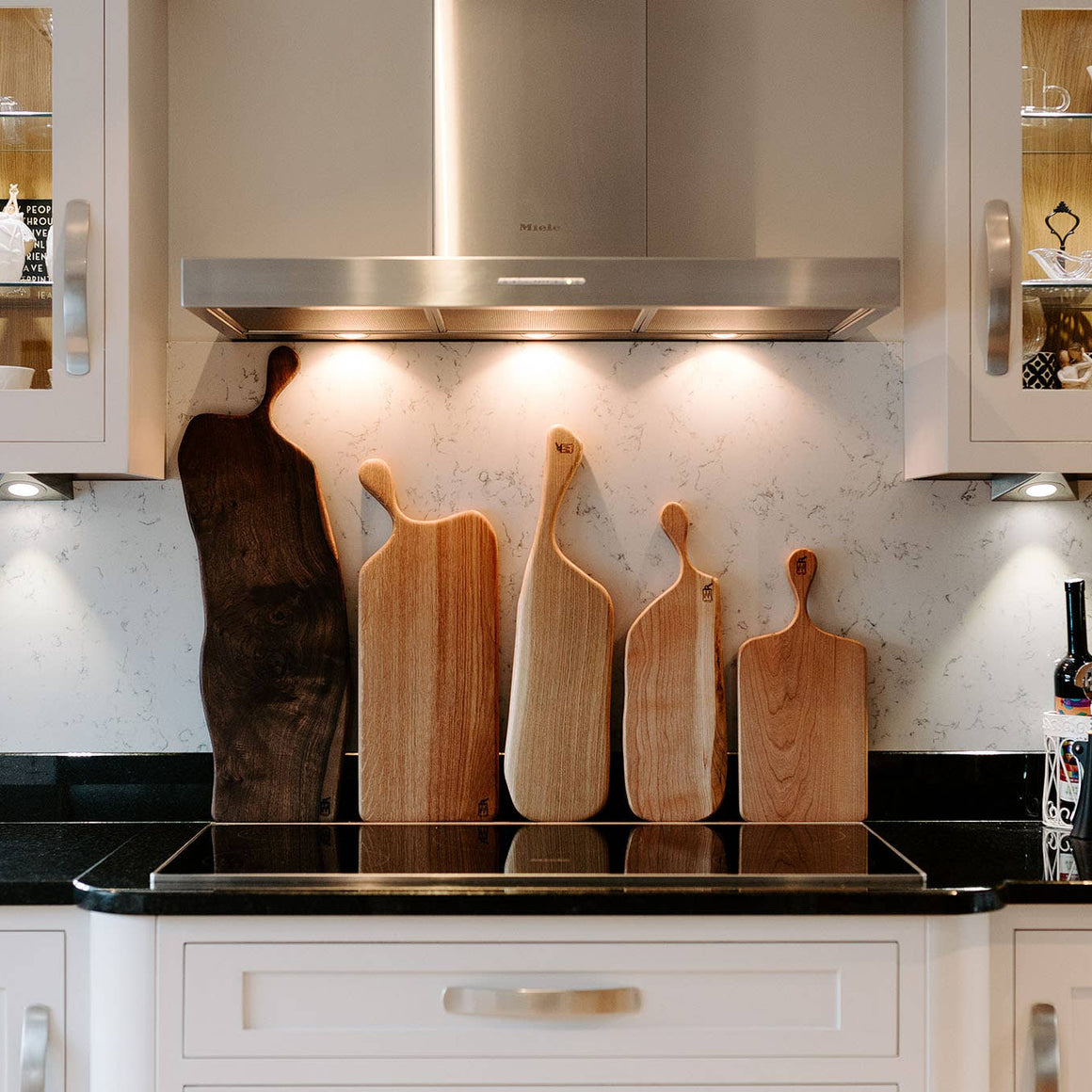 Wooden cutting board with handle on a white background