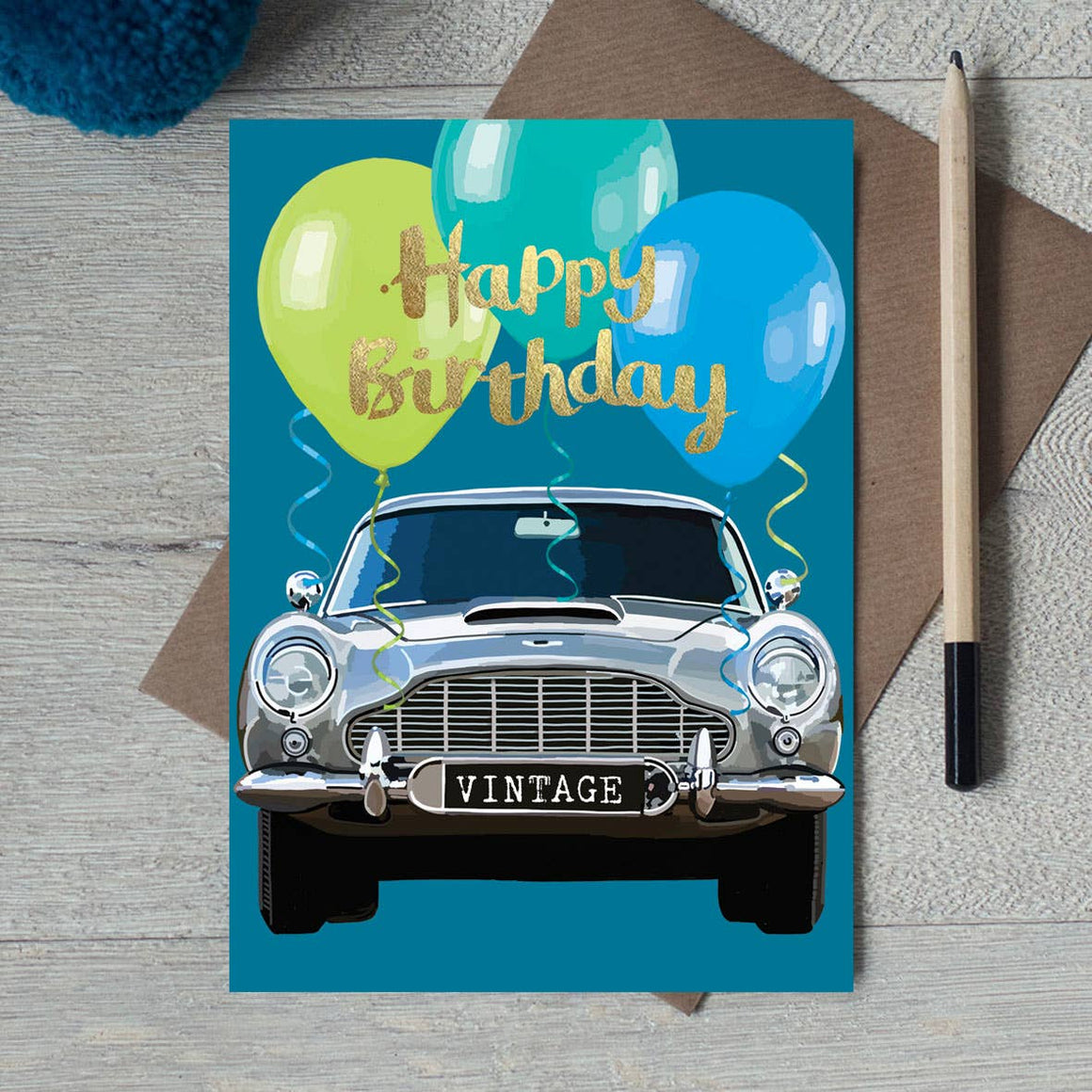 Vintage car foil birthday card featuring a classic car design, perfect for celebrating with a charming garden-themed accessory.