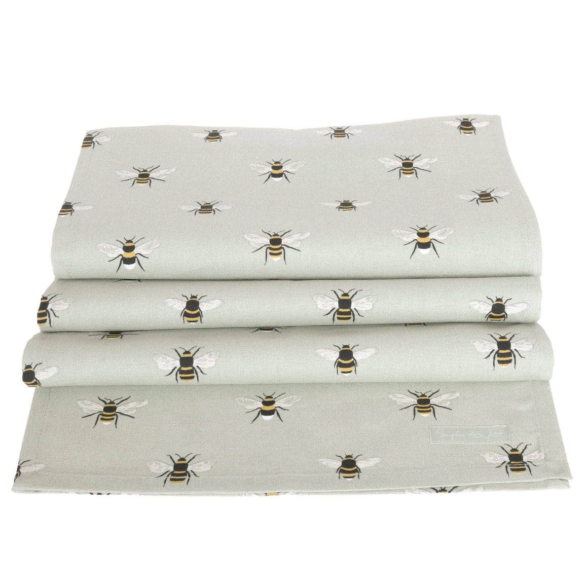 Folded fabric with bee pattern on a light green background
