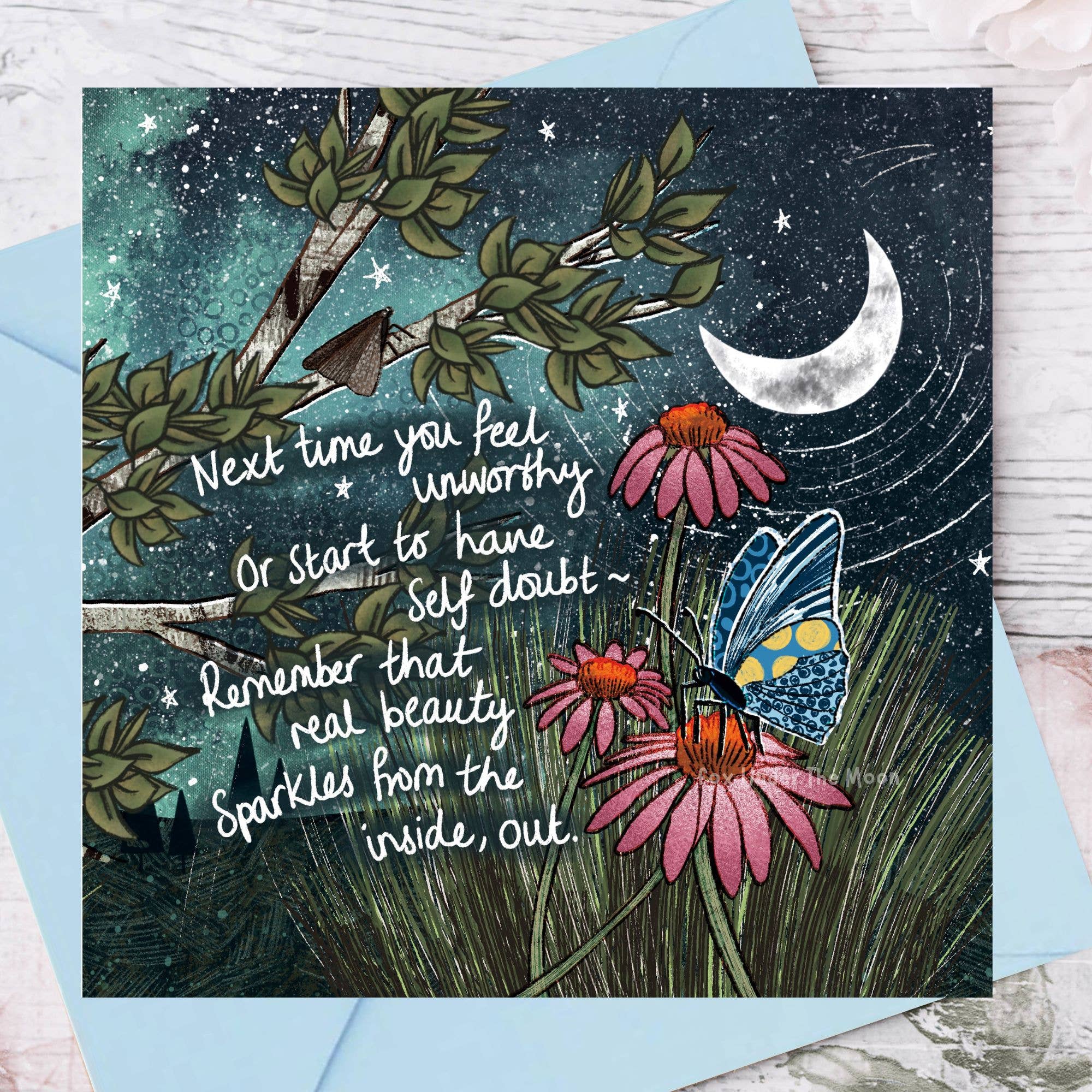 Greeting card with butterfly, flowers, and motivational quote on a starry night background