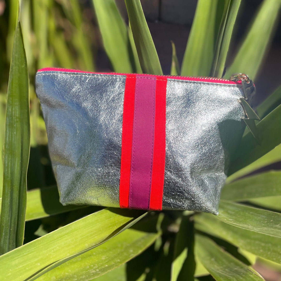 Small Sheeny Silver Cockatoo cosmetic bag with a shiny metallic finish and compact design, perfect for organizing beauty essentials.