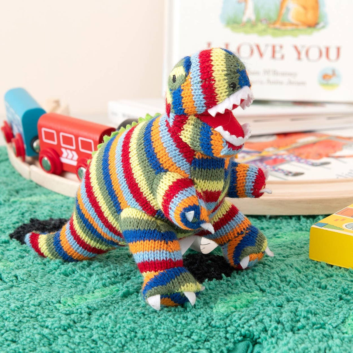 KNITTED STRIPE T REX DINOSAUR BABY RATTLE