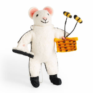 White mouse plush toy with black feet, pink ears, and a yellow honeycomb in its mouth on a white background