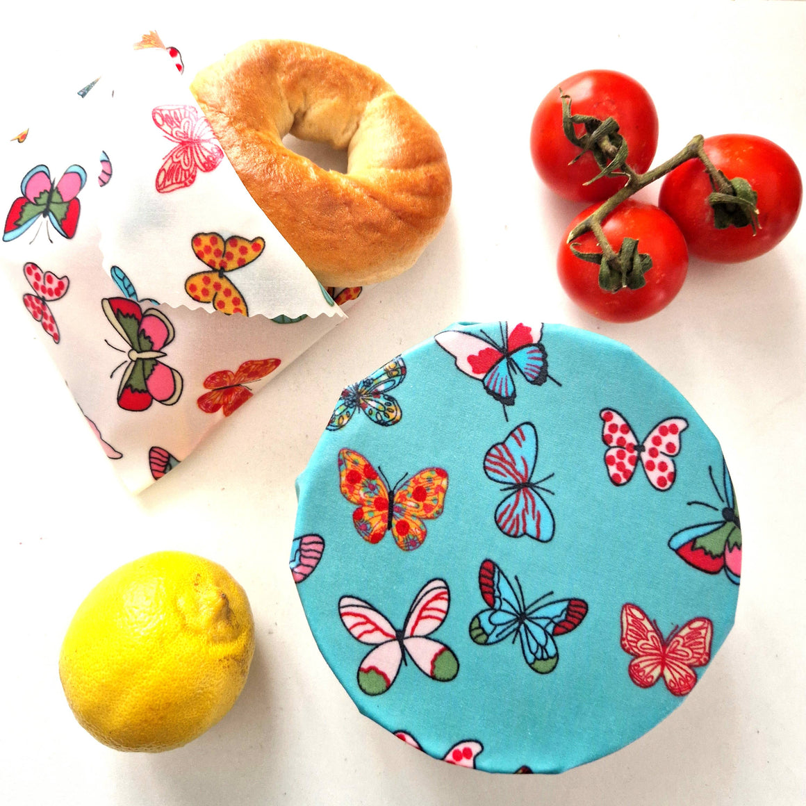 Honey Bee Good butterfly beeswax wraps pack with large, medium, and small wraps, showcasing colorful patterned beeswax-coated fabric.