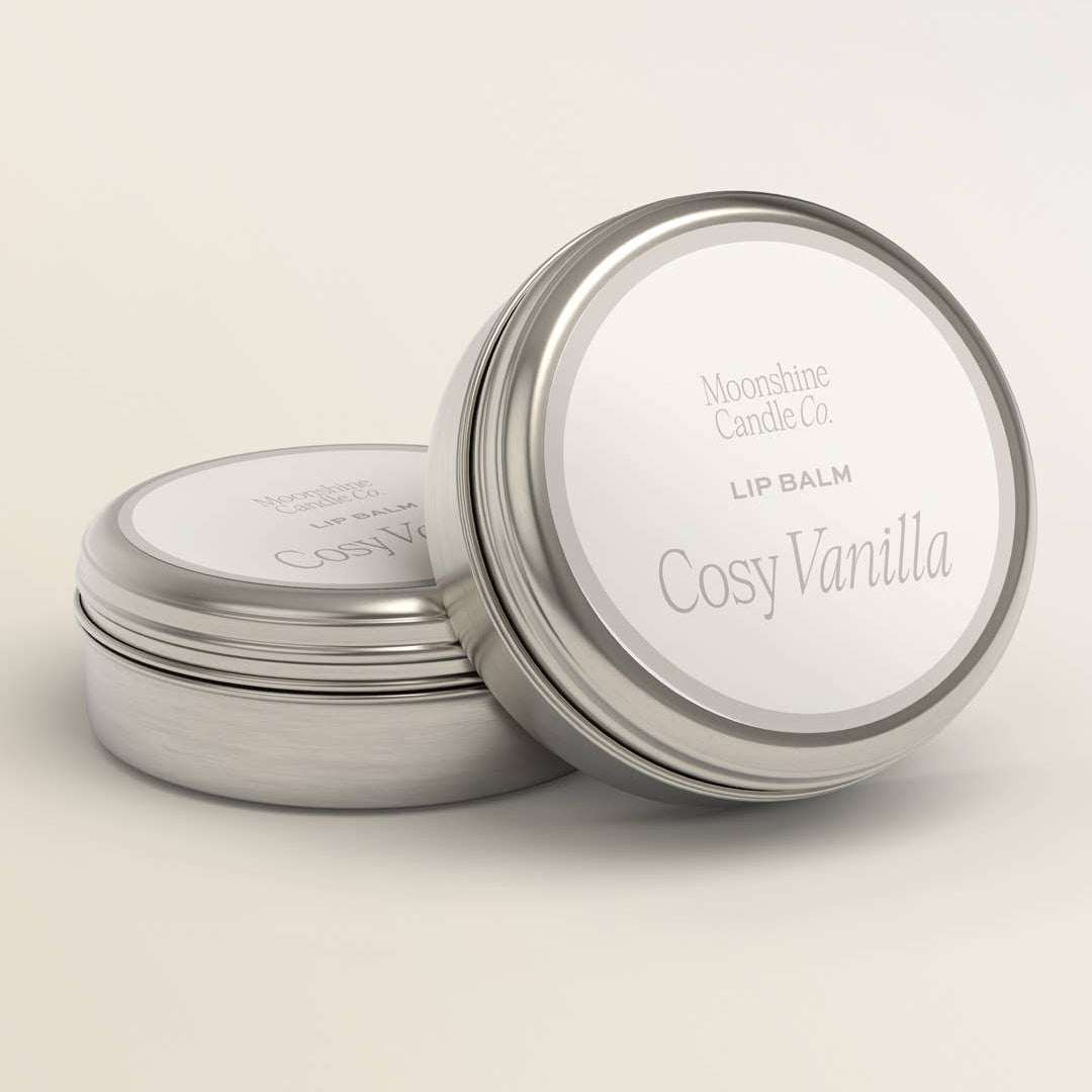 Moonshine Candle Co. Cosy Vanilla giftable lip balm in a sleek container with vanilla scent and smooth texture.