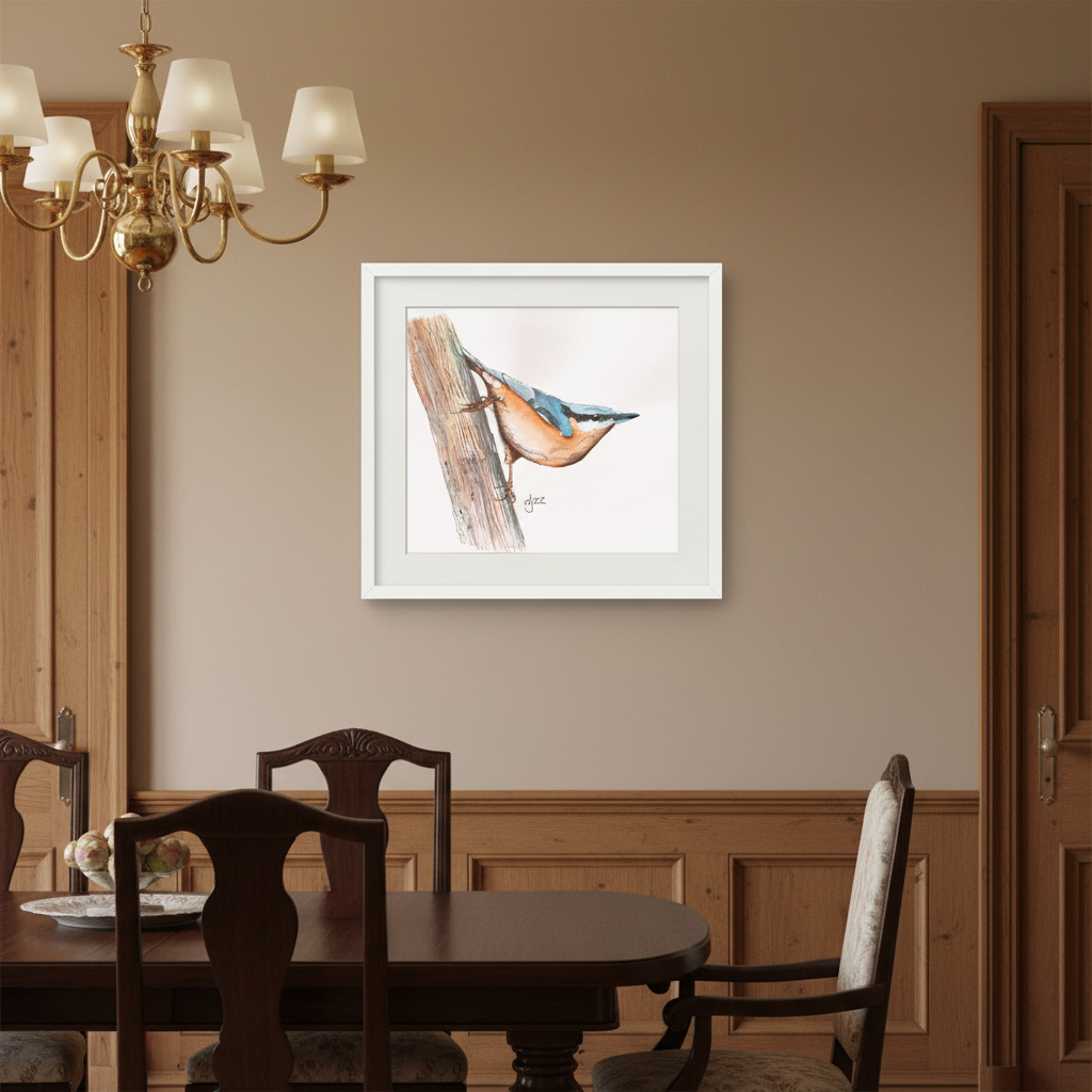A framed watercolor print of a bluebird perched on a tree branch, displayed on a beige wall in a dining room setting above a dark wood table and chairs.