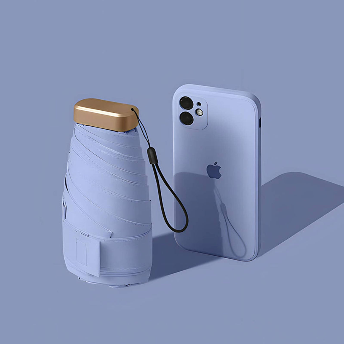 Collapsible umbrella and phone case on a blue background with 'TUTU.' branding.