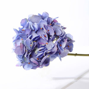 Purple artificial flower on a white background