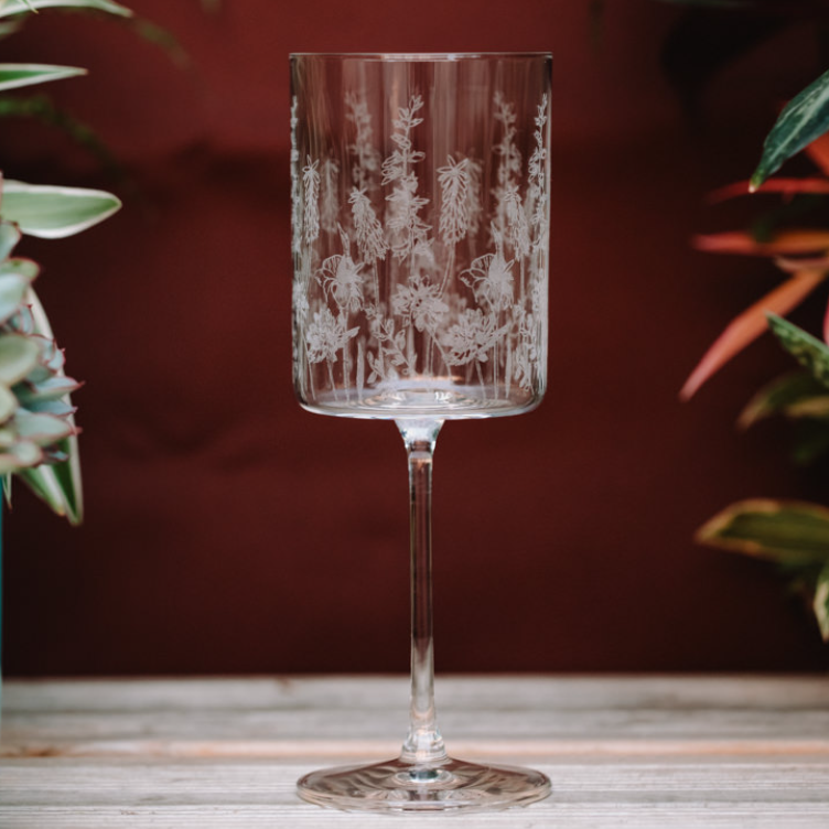 Elegant Emma Britton Exotic Floral wine glass, available in two sizes, showcasing vibrant floral design and clear glassware.