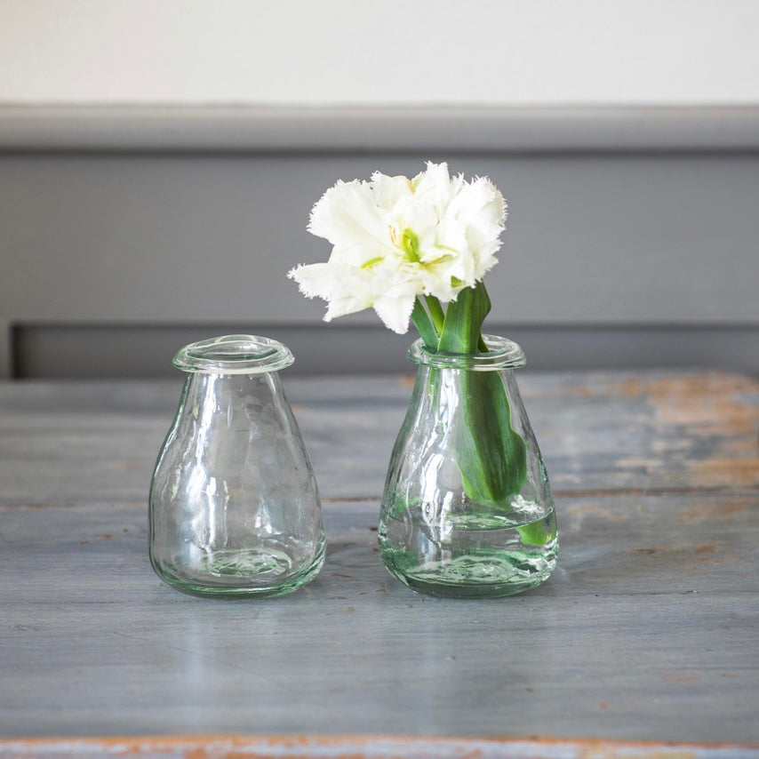Set of two recycled glass bud vases by Garden Trading, featuring clear, eco-friendly glass with a simple, elegant design.