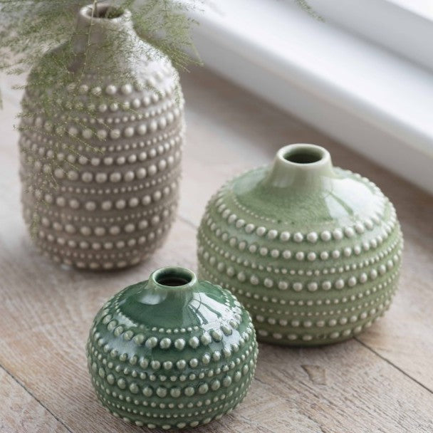 Small and medium ceramic Castello bottle vases by Garden Trading, featuring a sleek, rounded design in neutral tones.