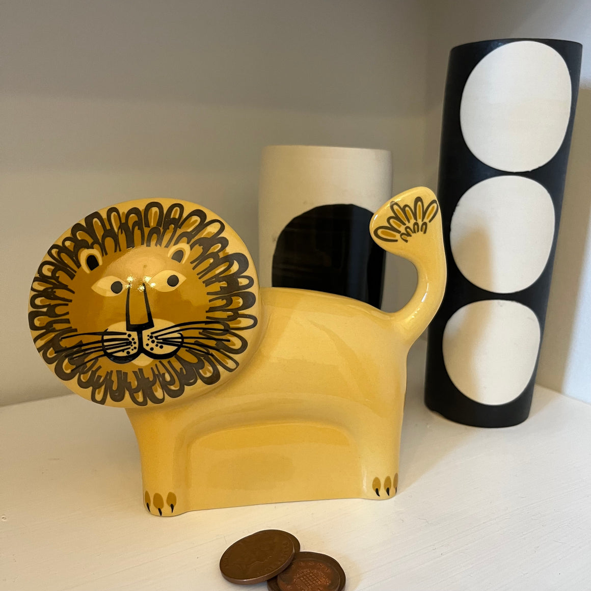 Hannah Turner animal-themed money boxes featuring a lion design, made of ceramic with colorful painted details.