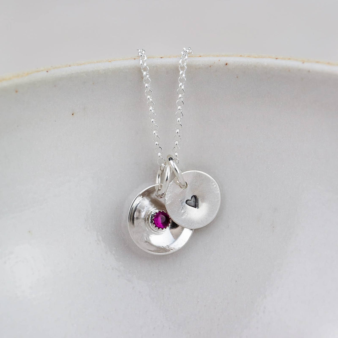 Sterling silver boho pendant with heart-shaped emerald by Lucy Kemp Jewellery on an 18-inch chain.