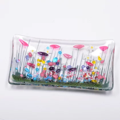 Handmade fused glass wildflower small dish by Pam Peters Designs, featuring colorful floral design and smooth glass edges.