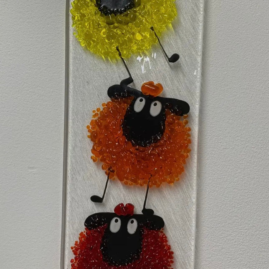 Fused glass sheep wall hanging by Pam Peters in blue tones, available in two color options, decorative wall art for home decor.