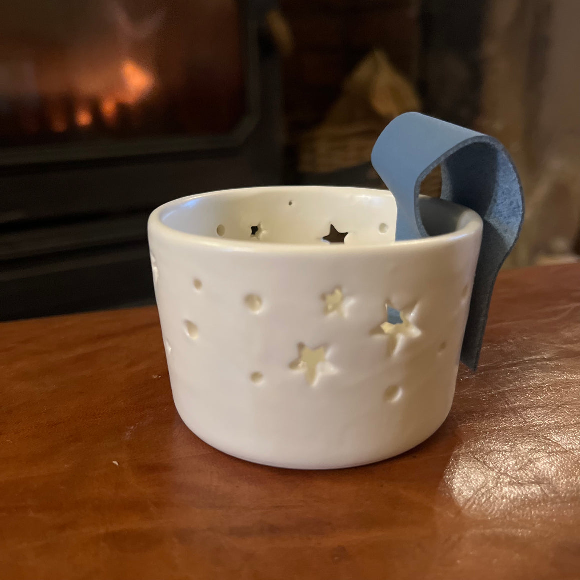 STAR TEA LIGHT HOLDER WITH LEATHER HANDLE